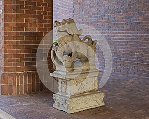 Ancient gaurdian Chinese foo dog at an entrance to the Anatole Hotel in Dallas, Texas.