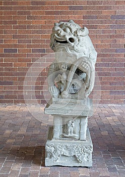 Ancient gaurdian Chinese foo dog at an entrance to the Anatole Hotel in Dallas, Texas.