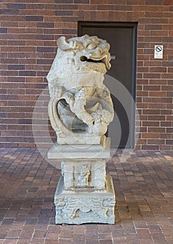 Ancient gaurdian Chinese foo dog at an entrance to the Anatole Hotel in Dallas, Texas.