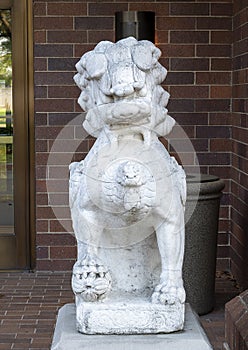 Ancient gaurdian Chinese foo dog at an entrance to the Anatole Hotel in Dallas, Texas.