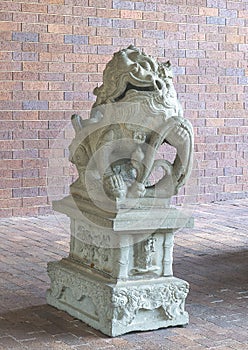 Ancient gaurdian Chinese foo dog at an entrance to the Anatole Hotel in Dallas, Texas.