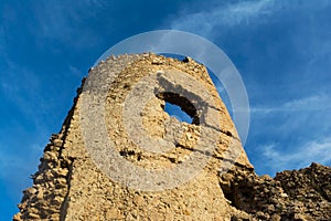 Ancient Genoese tower Cembalo on sky background photo
