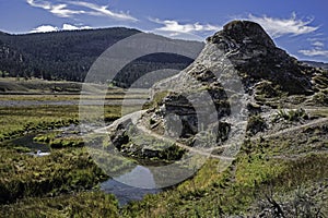 An ancient geyser marks the landscape of Yellowstone National Park.