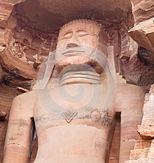 Ancient giant Jain statue carved out of rock in Gwalior, Madhya Pradesh, India photo