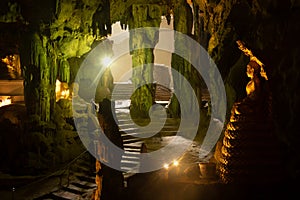 Ancient gold sitting Buddha at Entrances and exits At Khao Luang Cave.