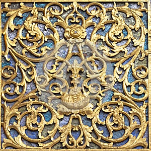 Ancient golden carving wooden door and wall of Thai temple. Thailand. And wall or door Palace