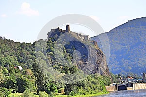 Ancient Gothic castle of Strekov on top of a high cliff above the river