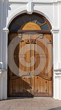 Ancient Gothic Church Portal Carved Wooden Door Church. Large Brown Antique Style Doors Full Frame.