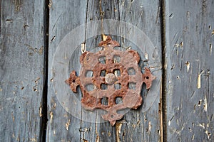 An ancient grating in an ancient building. Forged elements and decor