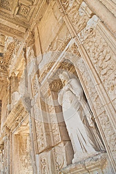 Ancient greek building facade with female statue