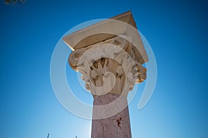 Ancient Greek column with clear sky as background