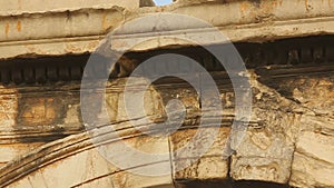 Ancient Greek inscription on architrave. Arch of Hadrian in Athens, Greece