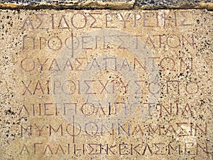 Greek inscription on a rock. Roman Theater in ancient Hierapolis. Pamukkale, Turkey