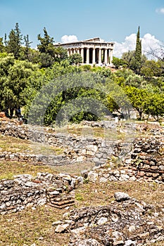 Ancient Greek ruins in Agora, Athens, Greece. Temple of Hephaestus in distance
