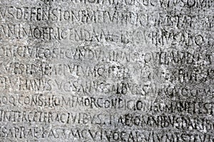 Ancient Greek writing chiseled on stone