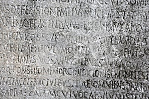 Ancient Greek writing chiseled on stone photo