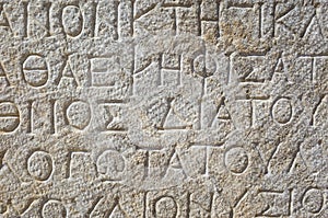 Ancient greek writing on stone in ancient city of Patara, Turkey. Close up