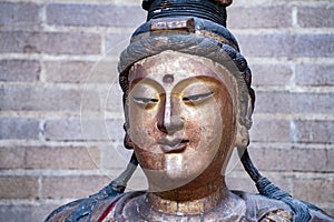 Ancient guanyin statue face detail