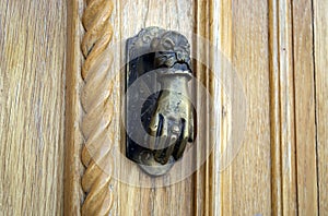Ancient hand doorknocker from copper
