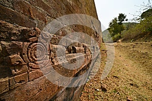 Ancient Handcarving on the brick wall excavated at Lalitiri Buddhist Archaeological site, Odisha, India.