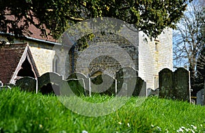 Ancient headstones in church cemetery. St James, Stedham, Sussex