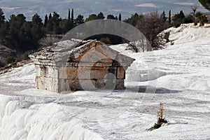Ancient hellenic tomb submerged in travertine pool in Hierapolis, Pamukkale in Turkey scenic view
