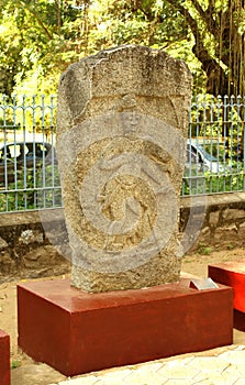 Ancient heroic man monument stone at museum photo