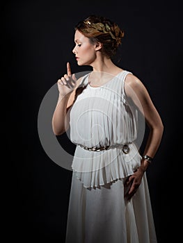 An ancient heroine, a young woman in image of an ancient Greek goddess or muse.