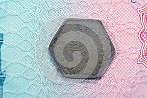 Ancient hexagon old two 2 piasters coin at the era of king Farouk I features value and kingdom of Egypt on a side and a bust of photo