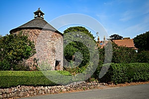 The ancient, historic round brick dovecote at Dunster, Somerset, UK
