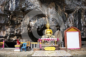 Ancient holy buddha statue in antique mystery cave for thai people traveler travel visit respect praying blessing wish of Wat Huai