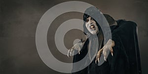 Ancient horror mutant vampire with large scary nails. Text place
