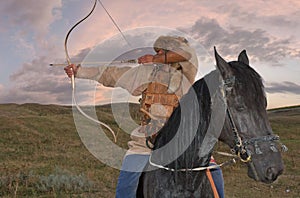 Ancient horseman weaponed with arc