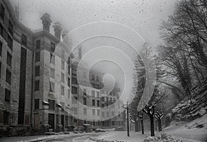 Ancient hotel abandoned under a heavy snowfall