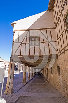 Ancient house in arcaded main square of Penaranda de Duero photo