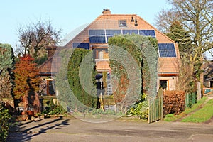 Ancient house with modern alternative solar panels, Netherlands