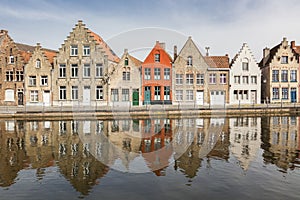 Ancient houses along a canal in Bruges photo