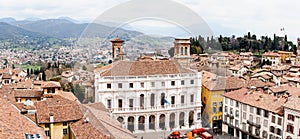 Ancient houses near tower Campanone Torre Civica in Piazza Vecchia in Bergamo. Italy