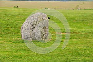 An ancient huge rock standing in the field, near Stonehenge in England, England