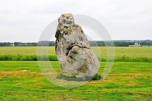 An ancient huge rock standing in the field, near Stonehenge in England, England