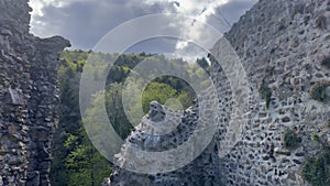 Ancient Hugstein Castle Ruins Overlooking Florival Valley, Alsace, with Springtime Verdure and Dynamic Sky