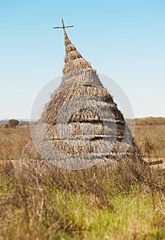 Ancient hut in a mediterranean meadow landscape. Cabaneros, Spai photo