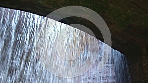 ancient hydraulic works arch Ravine Orrido Ponte Alto in Trento view from behind waterfall - Trentino Alto Adige Region