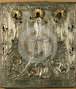 An ancient icon of the Transfiguration of God in a silver frame