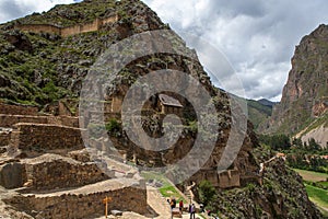 Ancient inka fortress in Ollantaytambo, Peru on cloudy day march 2019