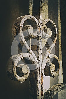 Ancient iron gate decoration swirly detail with rusty parts