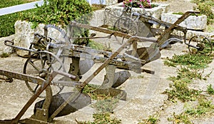 Ancient iron plows on a farm in the countryside