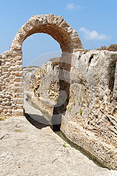 Ancient irrigation ditch and arch in archeological park in Israel