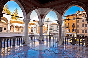 Ancient Italian square arches and architecture in town of Udine photo