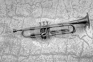 An ancient Jazz trumpet from the 1920s hanging on a wall